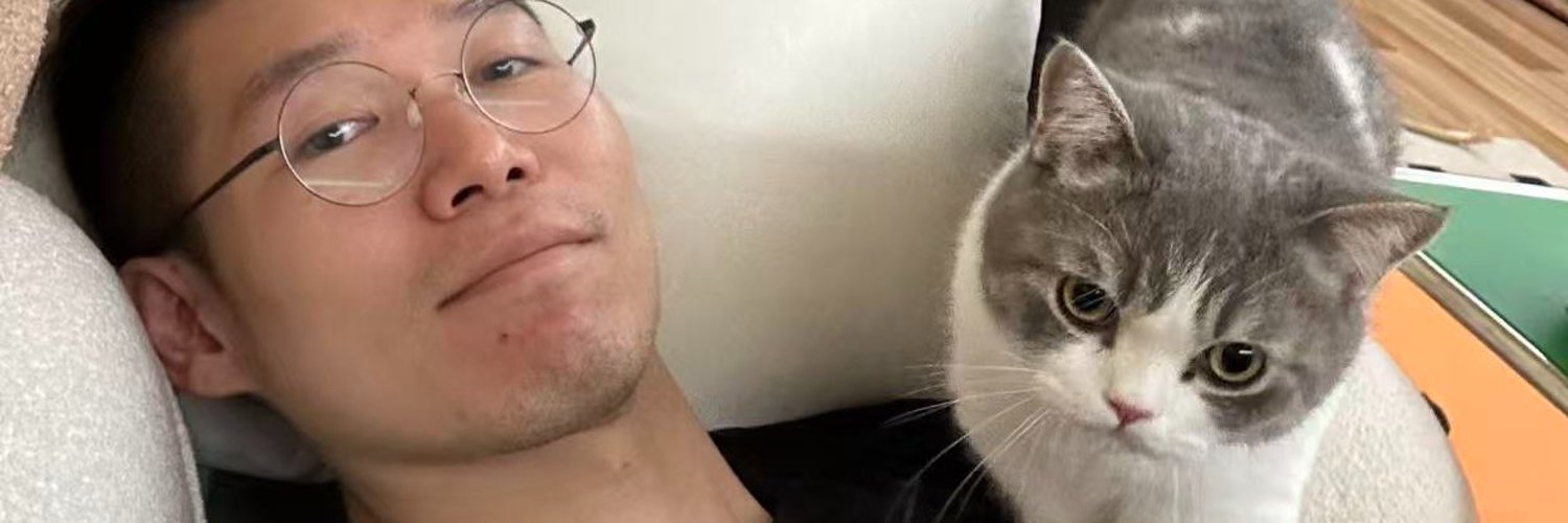 HaND. and his grey cat sharing a quiet moment at home